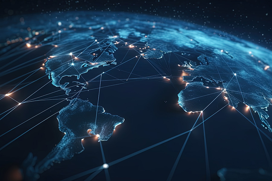 Lit up globe with connections across in blue lazer lines and gold dots.